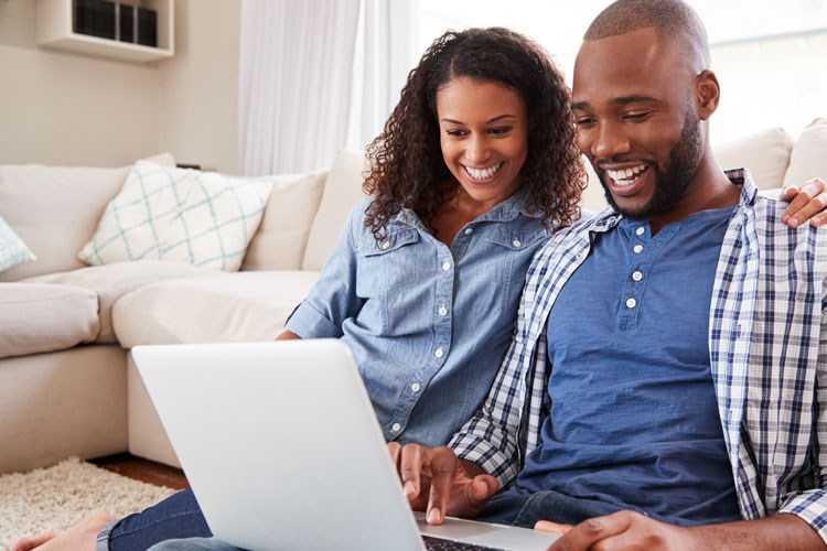 Couple looking online at homes