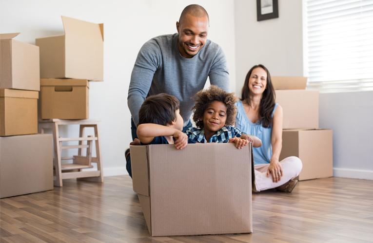 Family unpacking boxes